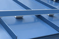 ColorBar snow rail with snap-in color strip and IceStoppers installed on a standing seam metal roof