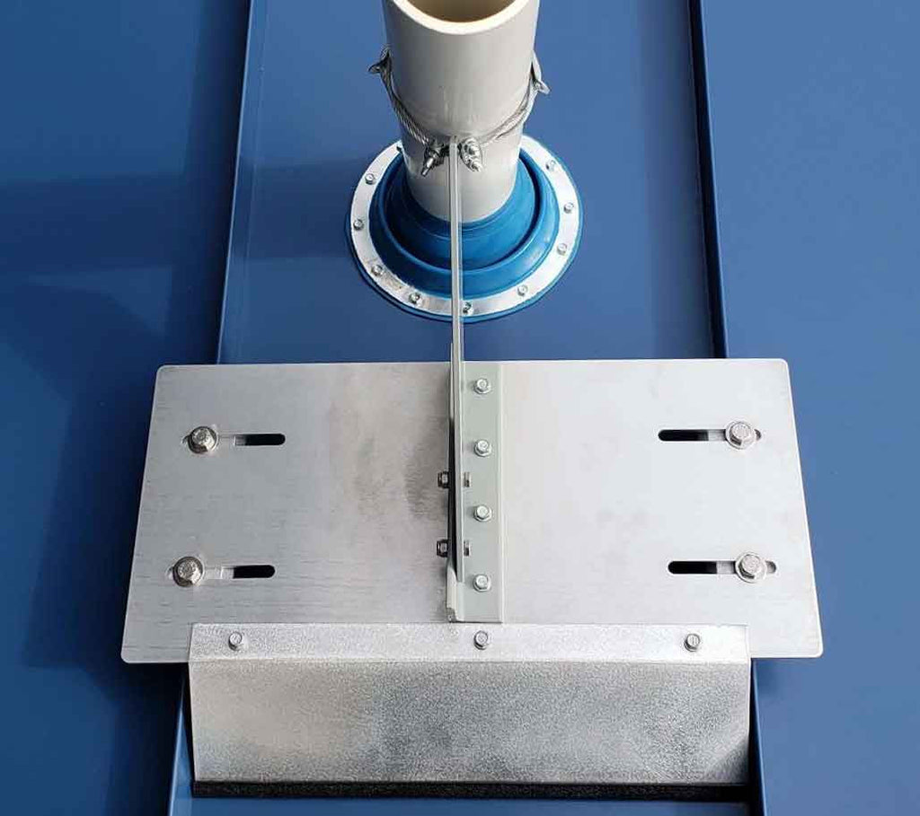 SS VentSaver plate installed on a standing seam metal roof without seam penetrations