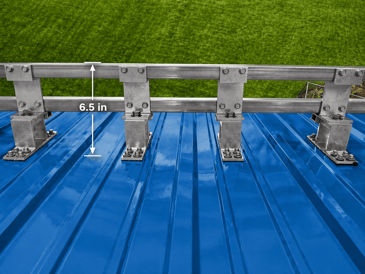 Metal roof snow guard system showing dual bars and support brackets preventing snow slide