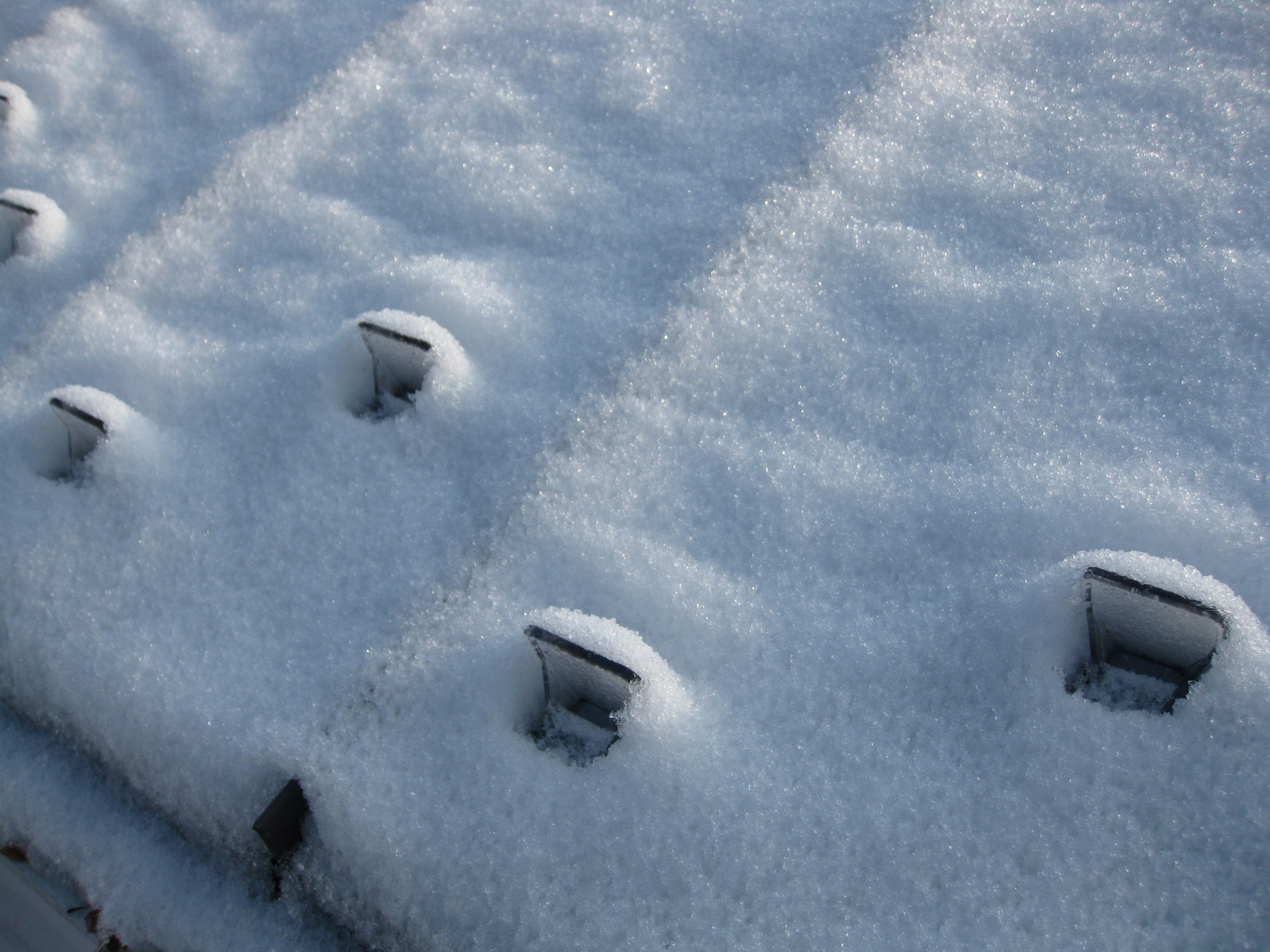 Close-up of snow-covered Roof with snow guards