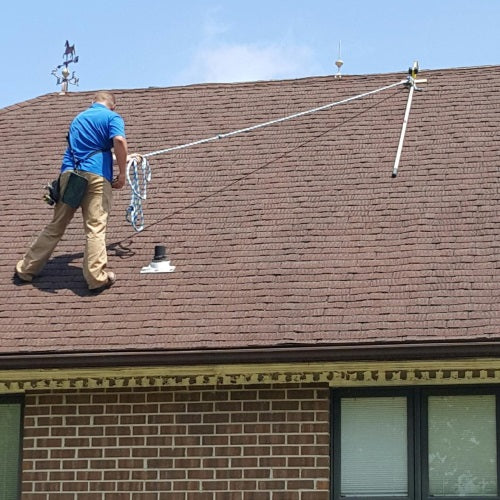 Setting up a RIDGEPRO mobile roof peak anchor without penetrating or damaging the roof.