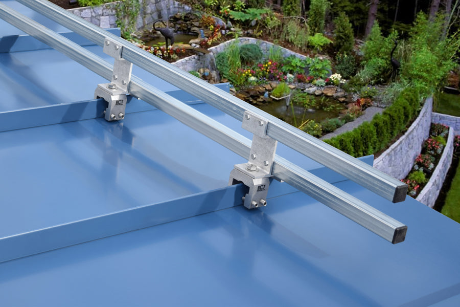 SnoBar double bar snow rail installed on standing seam metal roof for snow retention.