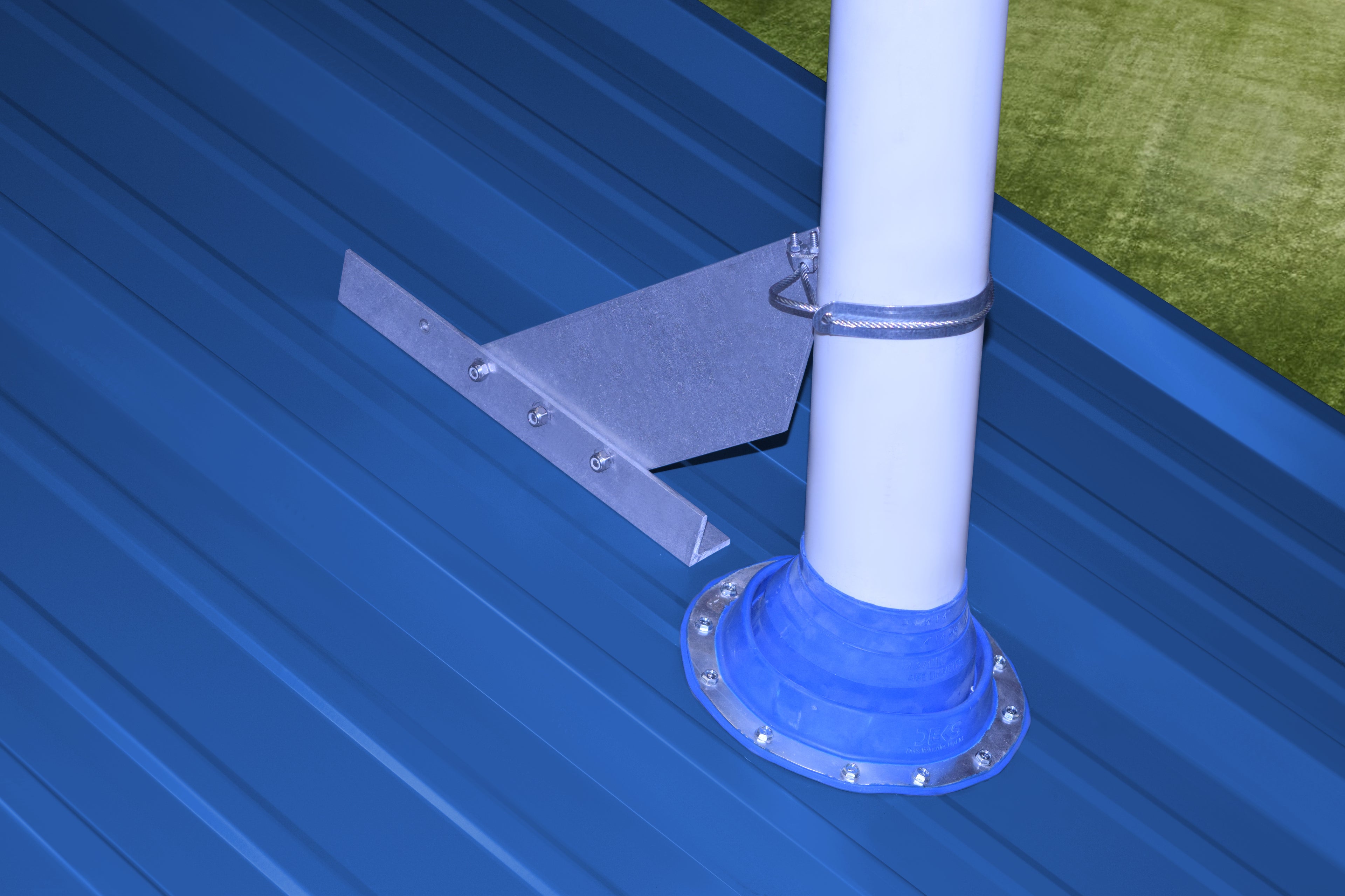 VentSaver EZ installed above a roof vent to deflect sliding snow on a metal roof.