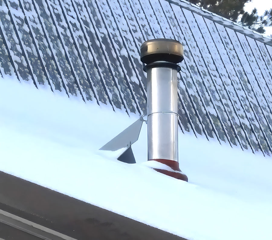 VentSaver HD snow diverter redirecting sliding snow around roof vent penetration